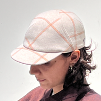 Lola is wearing a Le Panache Paris© cap N°121 made in France with Uptown fabric from Gabriel © 100% recyclable polyester